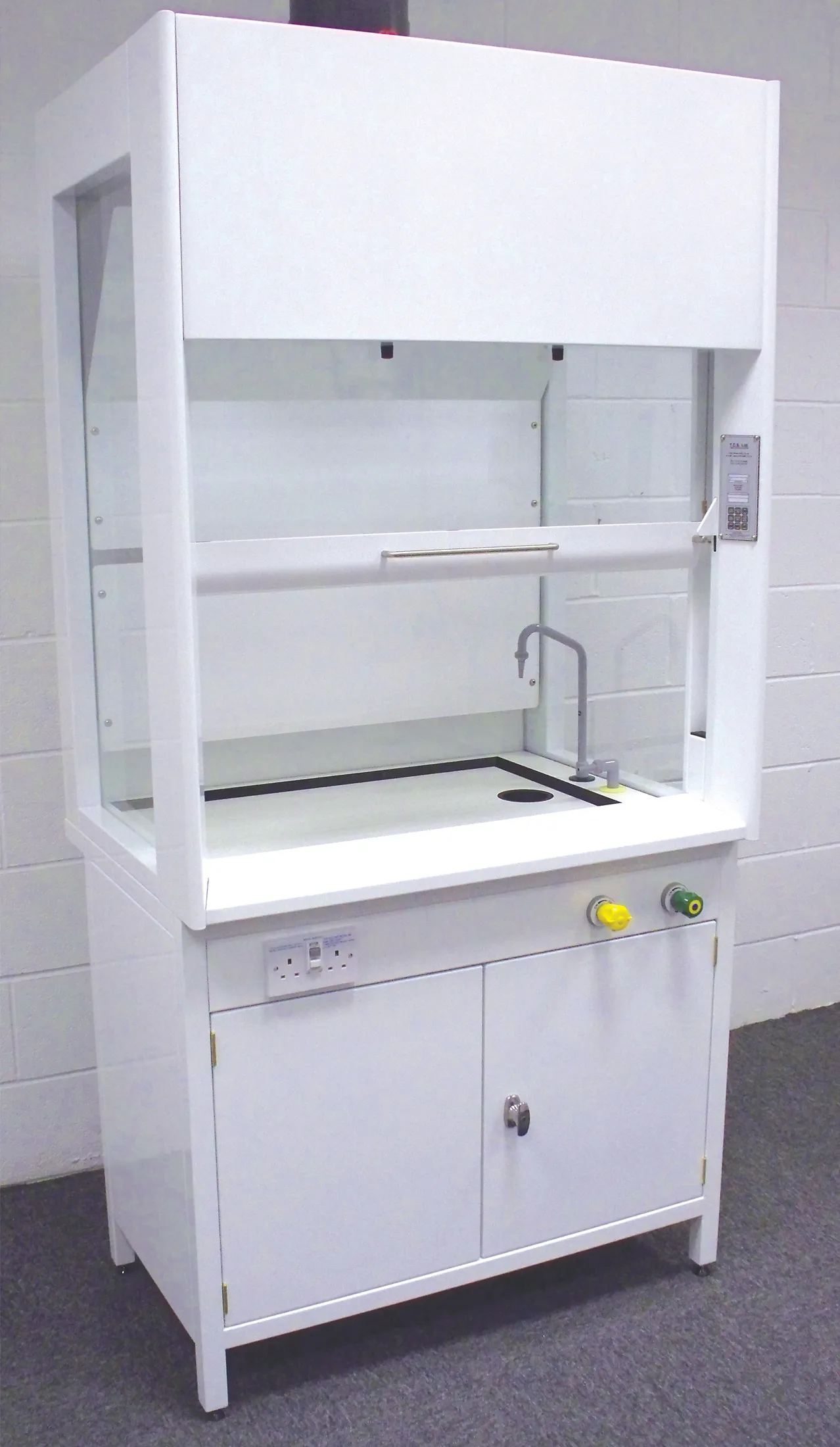 Built in fume cupboards with vented chemical storage below.