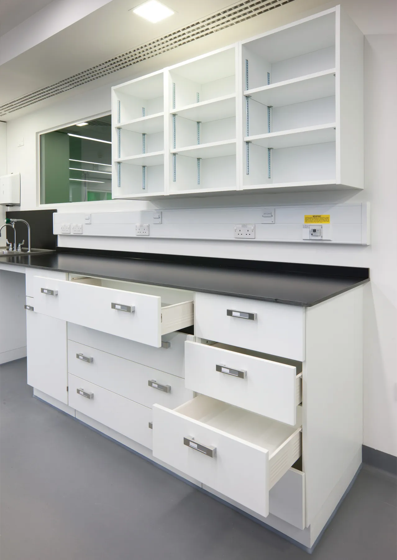 Fixed supporting units with above storage.